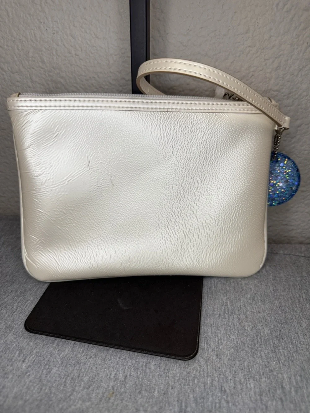 Coach Shimmering Ivory Leather Large Wristlet Clutch with Blue Glitter Charm